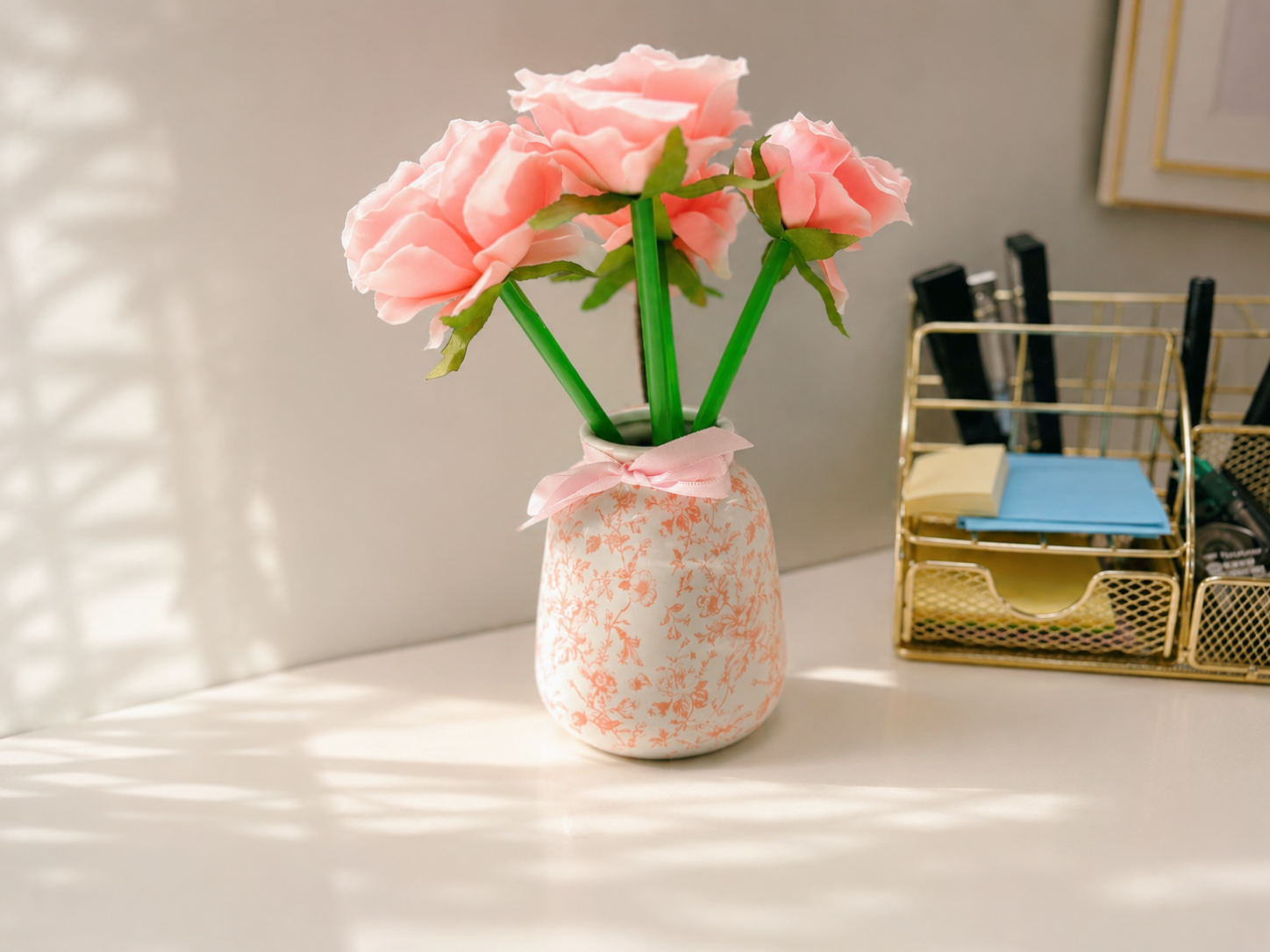Floral pens displayed in a small vase